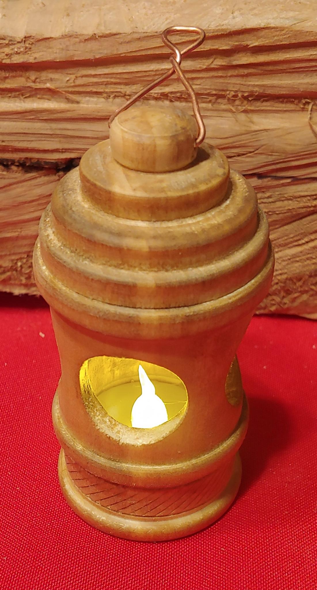Handcrafted wooden lantern with a small light inside